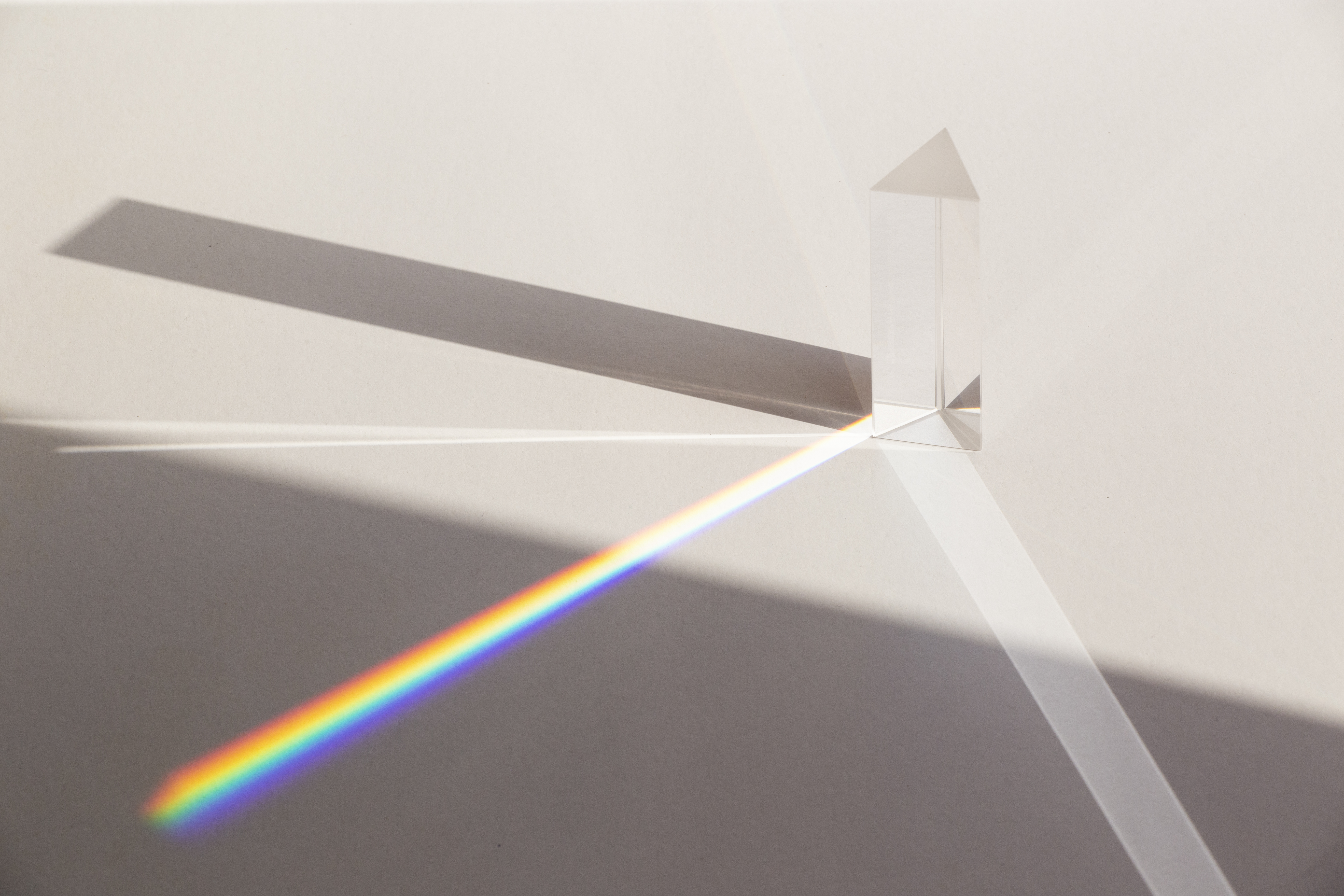 Light refracting through a prism — perspectives converging into a spectrum of insight